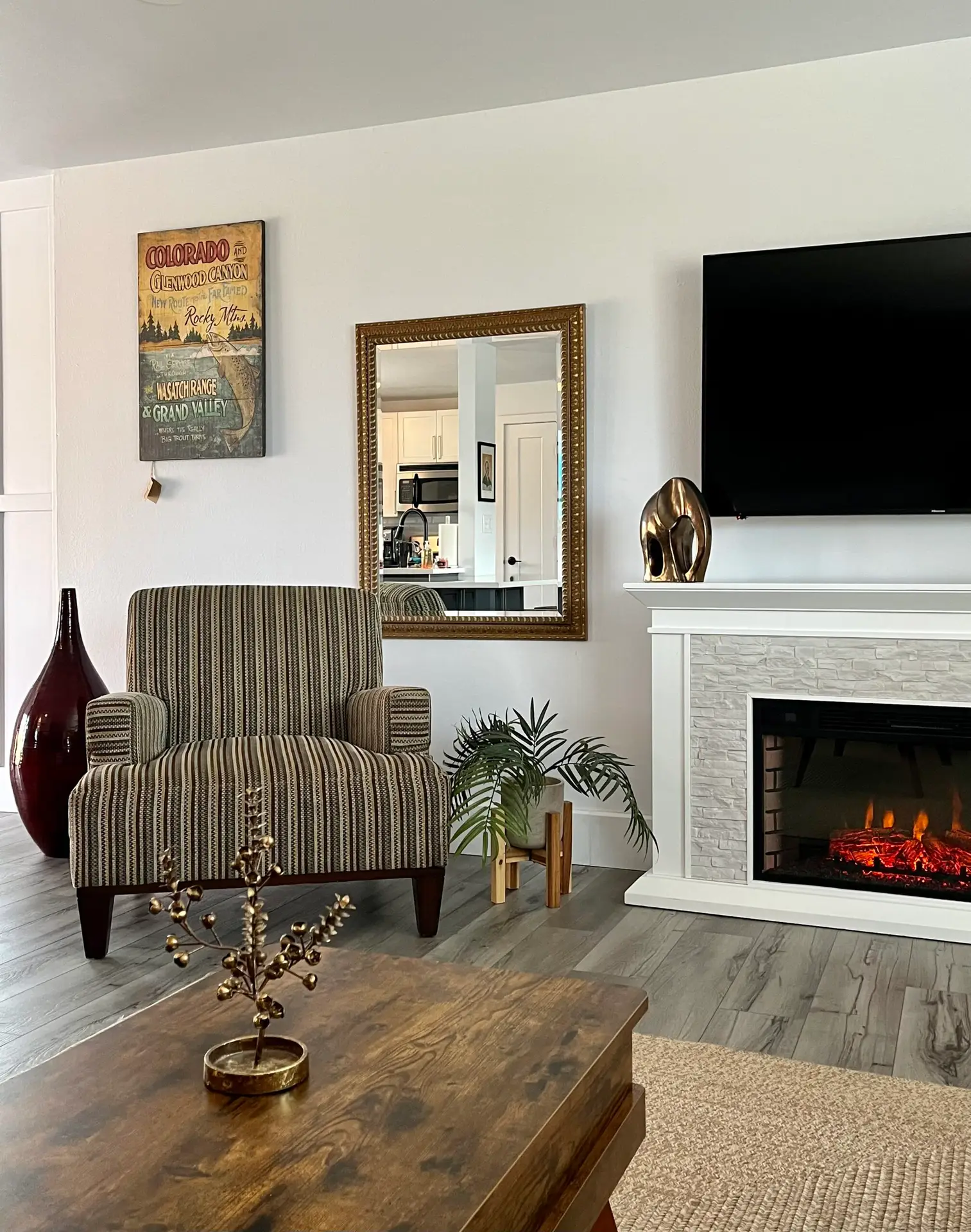 living-room-with-armchair-electric-fireplace-and-coffee-table