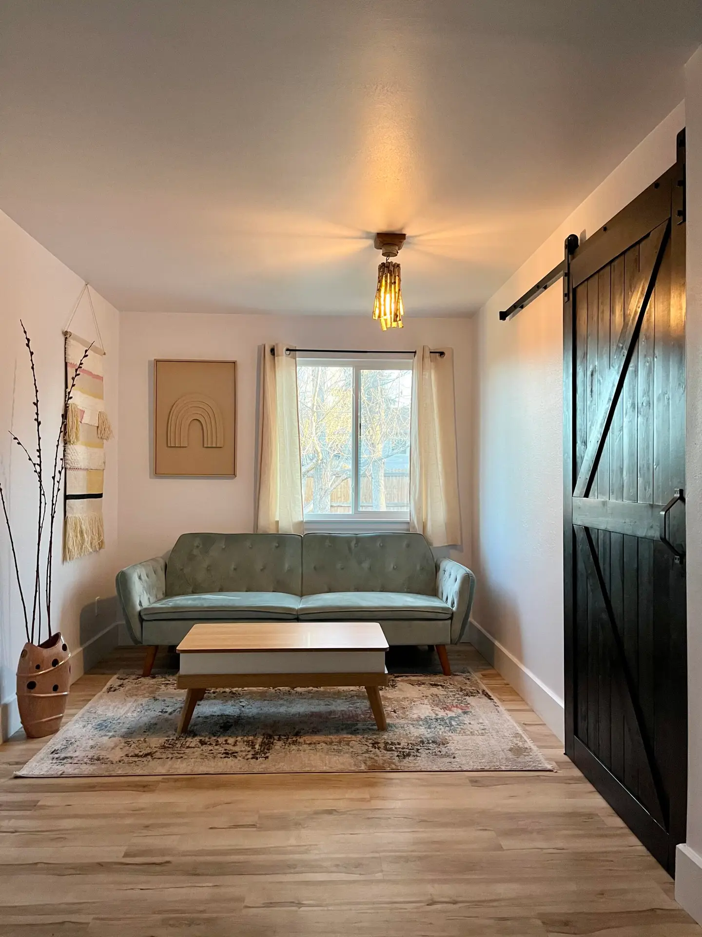 minimalist-living-room-with-sofa-and-barn-door