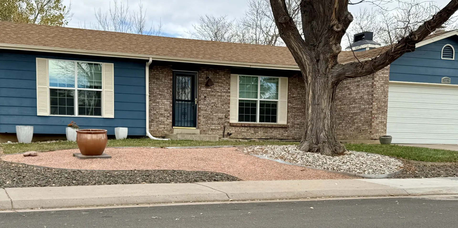 single-story-brick-house-with-landscaped-yard